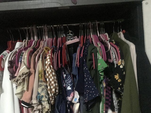 Clothes hanged inside a closet