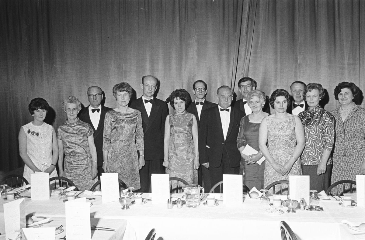 Guests at a formal black-tie dinner